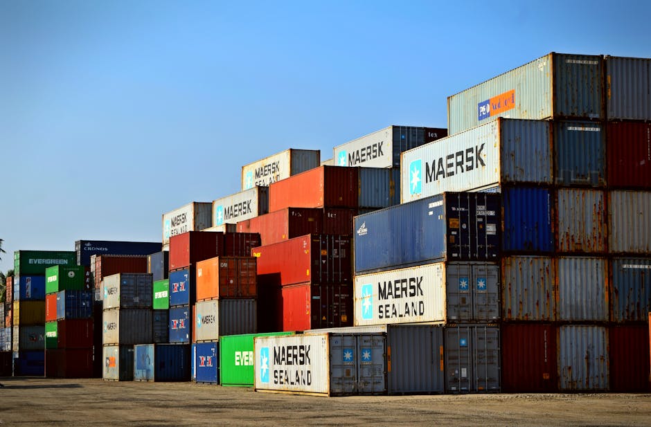 Offering Colorful stacked shipping containers at a port exemplify global logistics.